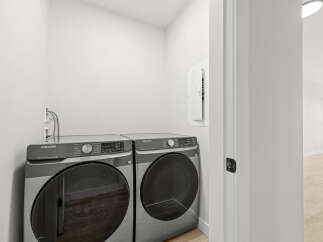 Discover modern convenience with this stacked Samsung washer and dryer set, perfect for any laundry room.
