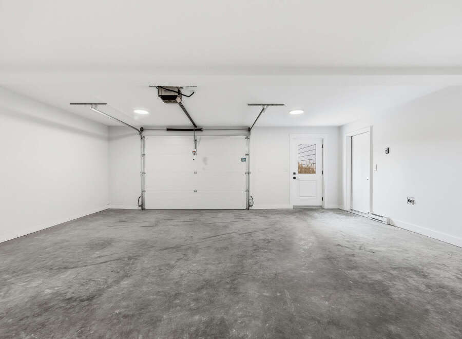 Discover this spacious and clean garage, perfect for your vehicles and storage needs.