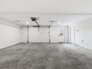 Discover this spacious and clean garage, perfect for your vehicles and storage needs.