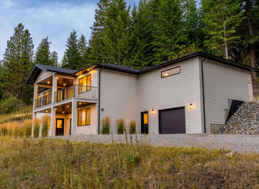 Nestled amidst a serene forest, this modern home offers stunning natural views and contemporary living.