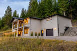 Nestled amidst a serene forest, this modern home offers stunning natural views and contemporary living.