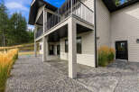 Experience modern living in this stunning home featuring a spacious covered patio perfect for outdoor entertaining.
