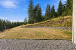Discover the potential of this expansive lot, featuring a gently sloping lawn perfect for outdoor activities.
