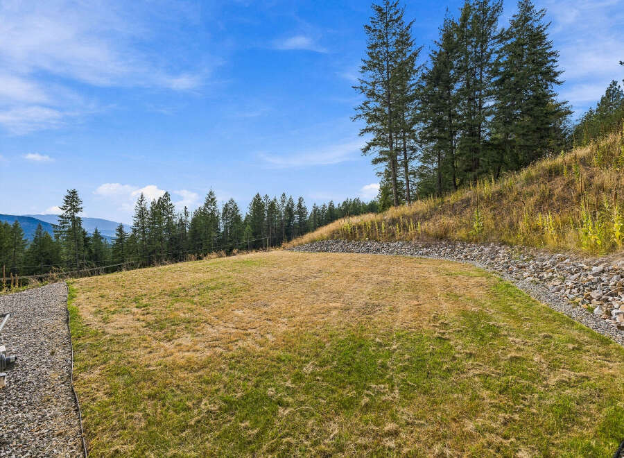 Discover the potential of this expansive backyard, perfect for creating your dream outdoor oasis.