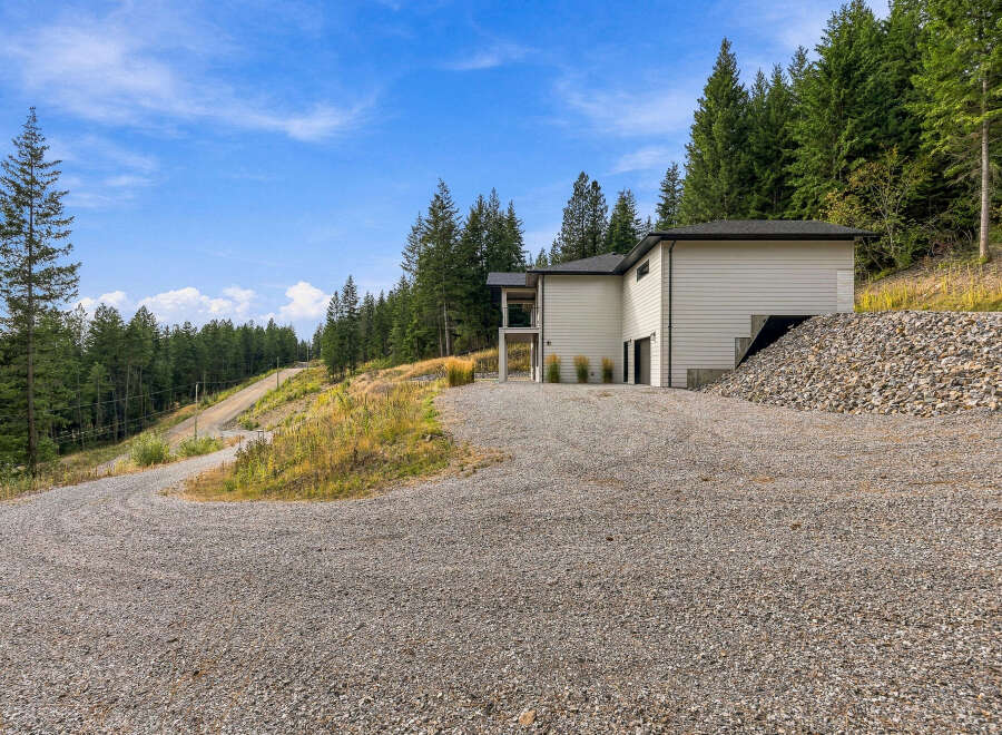 Discover modern living nestled amidst a serene forest landscape.