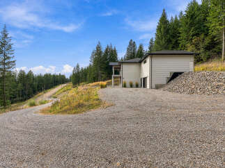 Discover modern living nestled amidst a serene forest landscape.