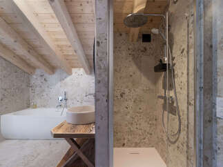 Experience modern luxury in this stunning bathroom featuring a freestanding bathtub and a spacious walk-in shower.