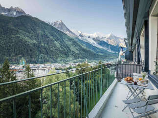 Experience breathtaking mountain views from this charming balcony, perfect for enjoying your morning coffee or evening wine.
