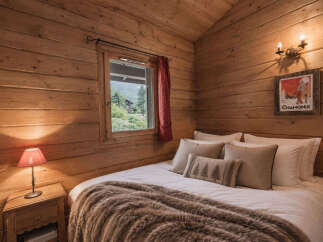 Experience cozy mountain living in this charming log cabin bedroom.
