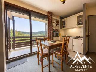 Enjoy breathtaking mountain views from this charming dining area, perfect for morning coffee or evening meals.