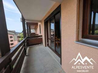 Enjoy the fresh mountain air from this charming balcony, offering picturesque views of the surrounding village and rolling hills.