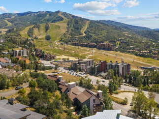 Experience mountain living at its finest in this stunning property nestled amidst the scenic beauty of a ski resort.