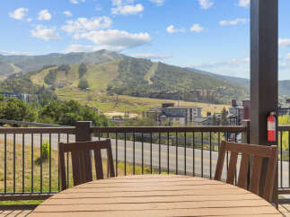 Enjoy breathtaking mountain views from this stunning property's private balcony, perfect for morning coffee or evening relaxation.
