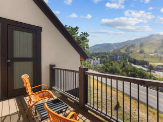 Enjoy breathtaking mountain views from this charming balcony, perfect for morning coffee or evening relaxation.