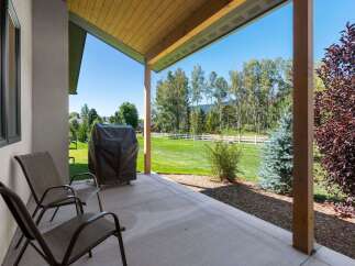 Enjoy outdoor living with this covered patio, perfect for relaxing or entertaining.