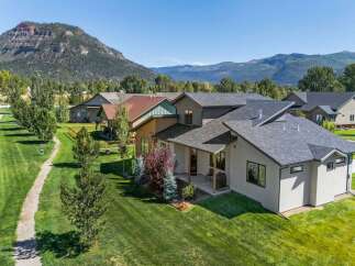 Discover modern living in this stunning home, nestled against a backdrop of majestic mountains.