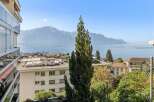 Experience breathtaking panoramic views of the serene lake and majestic mountains from this exceptional property.