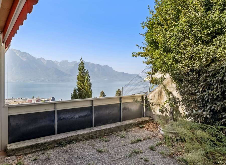 Experience breathtaking panoramic views of the lake and majestic mountains from this property's balcony.
