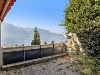 Experience breathtaking panoramic views of the lake and majestic mountains from this property's balcony.