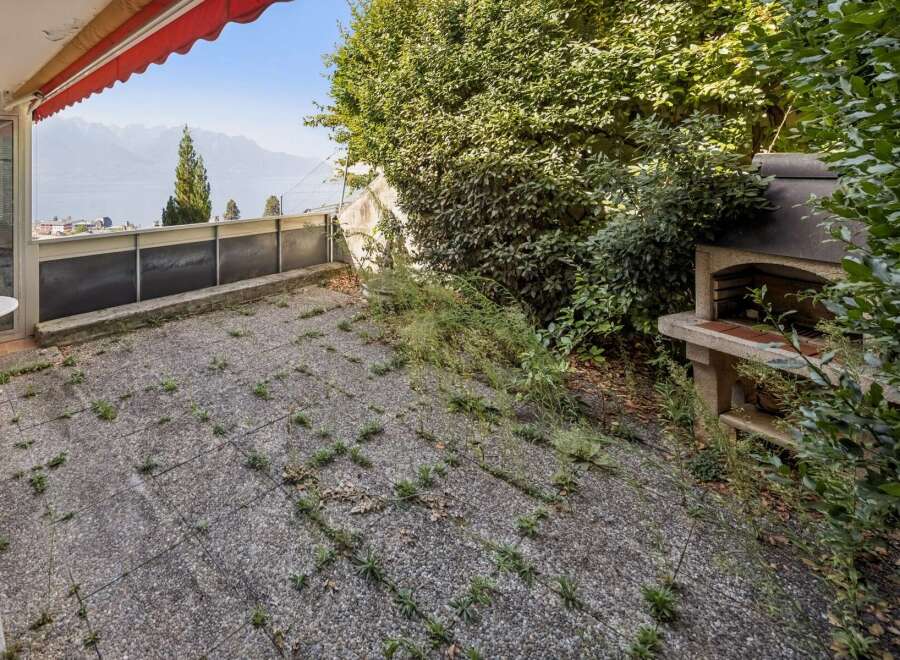 Enjoy breathtaking lake and mountain views from this spacious patio, perfect for outdoor entertaining.