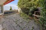 Enjoy breathtaking lake and mountain views from this spacious patio, perfect for outdoor entertaining.