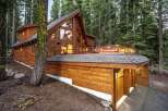Nestled amidst towering pine trees, this stunning wooden mountain home offers a luxurious retreat.