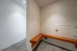This inviting space features a built-in wooden bench, perfect for a mudroom or entryway.