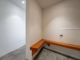 This inviting space features a built-in wooden bench, perfect for a mudroom or entryway.