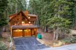 Nestled amidst towering pine trees, this stunning wooden mountain home offers a serene retreat.