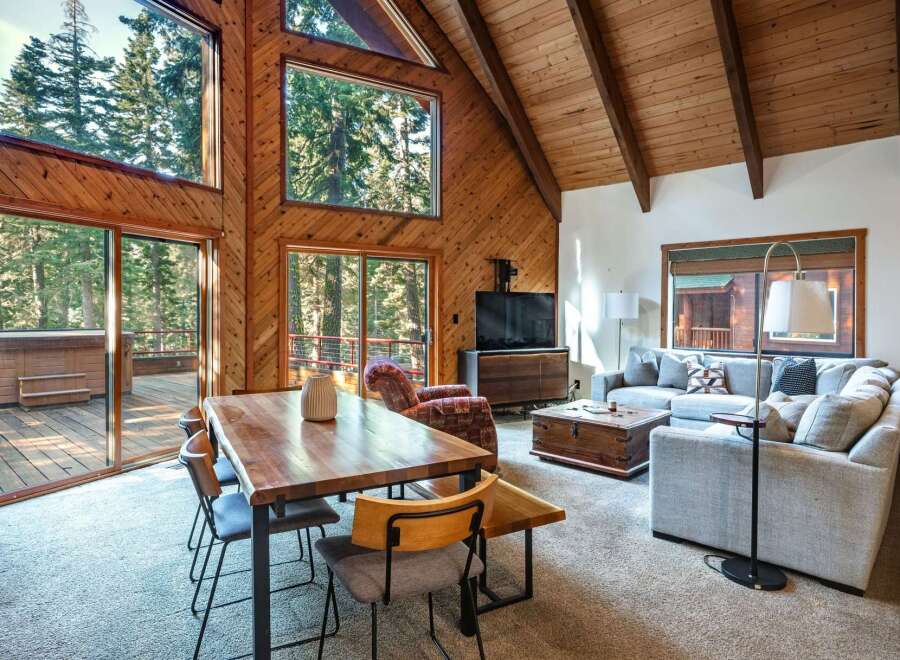 Experience rustic charm and modern comfort in this stunning A-frame cabin living space.