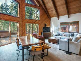 Experience rustic charm and modern comfort in this stunning A-frame cabin living space.