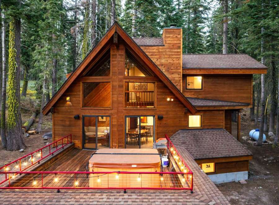Experience the ultimate mountain retreat in this stunning A-frame cabin nestled amongst tall pines.