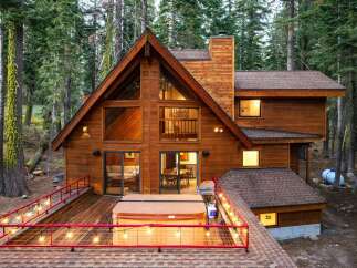 Experience the ultimate mountain retreat in this stunning A-frame cabin nestled amongst tall pines.