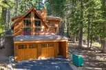 Nestled amidst towering pine trees, this stunning wooden mountain home offers a serene retreat.