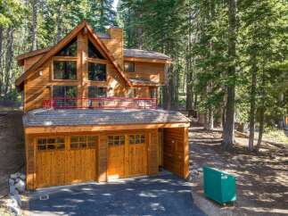 Nestled amidst towering pine trees, this stunning wooden mountain home offers a serene retreat.