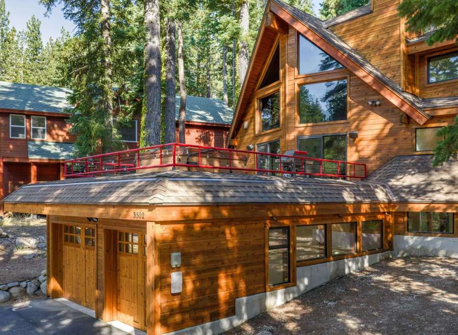 Experience rustic charm and modern comfort in this stunning wooden A-frame home nestled among tall pine trees.