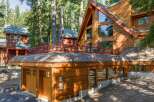 Experience rustic charm and modern comfort in this stunning wooden A-frame home nestled among tall pine trees.
