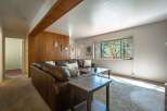 Step into this inviting living room featuring a plush brown leather sectional sofa, perfect for cozy gatherings.