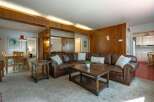 This spacious living area features a large, comfortable sectional sofa perfect for family gatherings.
