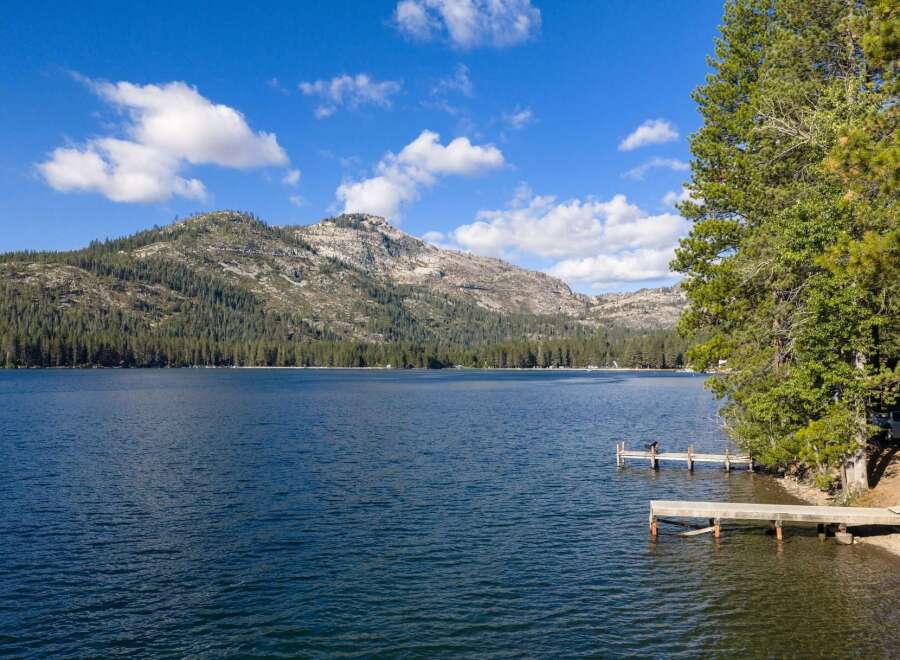 Experience serene lakefront living with this stunning property, featuring private docks perfect for your boat or morning coffee.