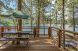 Enjoy breathtaking lake views from this spacious deck, perfect for outdoor dining and relaxation.