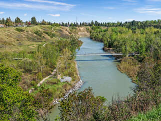 Discover a serene lifestyle with this property offering breathtaking views of a winding river and lush green parkland.