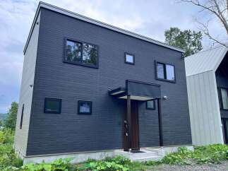 Discover modern living in this sleek, dark-paneled two-story home.