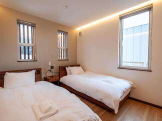 This inviting bedroom features two comfortable twin beds, perfect for accommodating guests or family.
