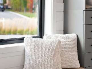 Experience cozy living with these plush, textured throw pillows, perfect for adding comfort and style to your home.