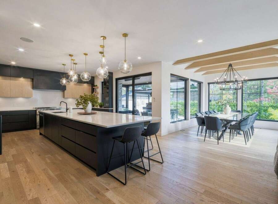 Experience modern luxury in this stunning open-concept kitchen and dining area.
