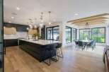 Experience modern luxury in this stunning open-concept kitchen and dining area.