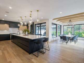 Experience modern luxury in this stunning open-concept kitchen and dining area.