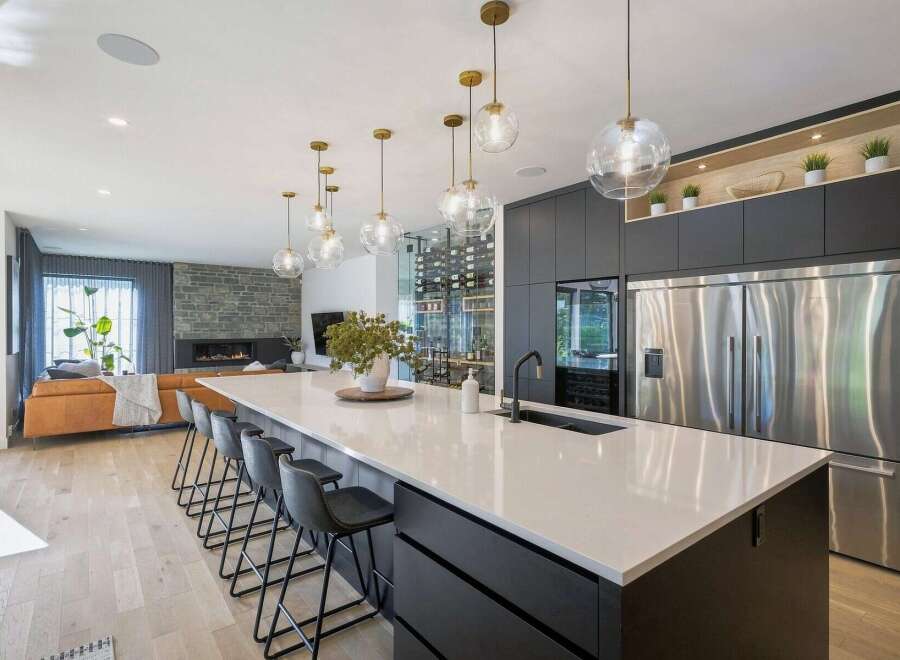 Experience modern luxury in this stunning open-concept kitchen and living area.