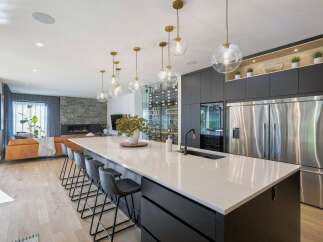 Experience modern luxury in this stunning open-concept kitchen and living area.